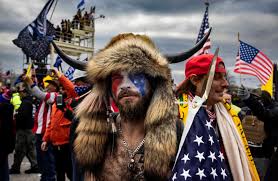 Jacob Chanley, the Qanon Shaman with horns in front of the American capitol. 