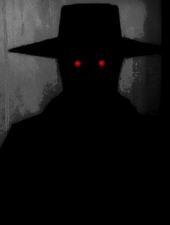 A man in the dark suit with red eyes.